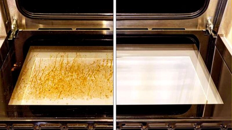 Donna pulisce il forno con un panno e detergente naturale.