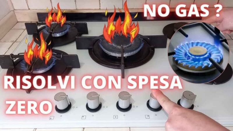 Bruciatore a gas con fiamma debole su fornello da cucina.