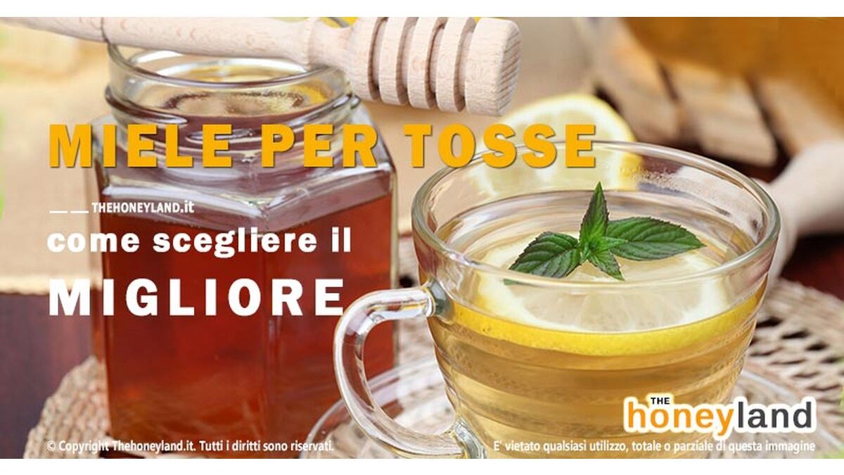 Barattoli di miele di kumquat e miele di limone su un tavolo di legno.